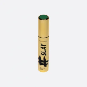 Μάσκαρα Elixir Black Volume σε χρυσό σωληνάριο, έντονο μαύρο χρώμα.